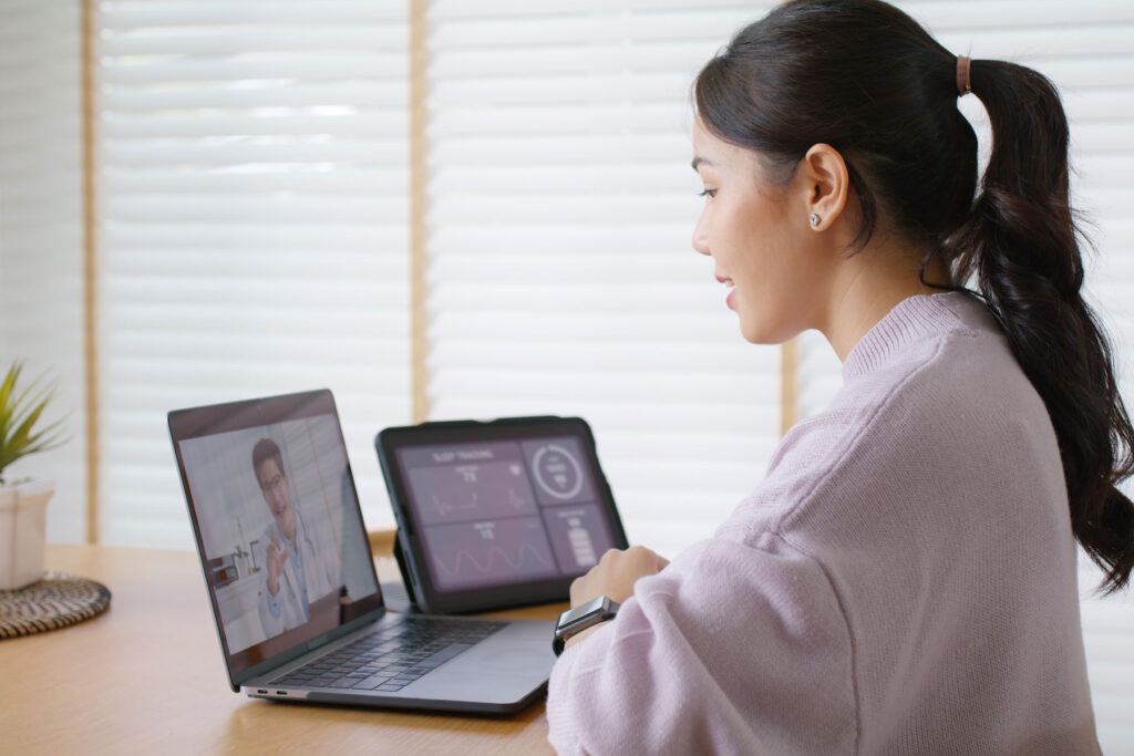 A patient is getting a an online medical second opinion while at home, using her laptop.